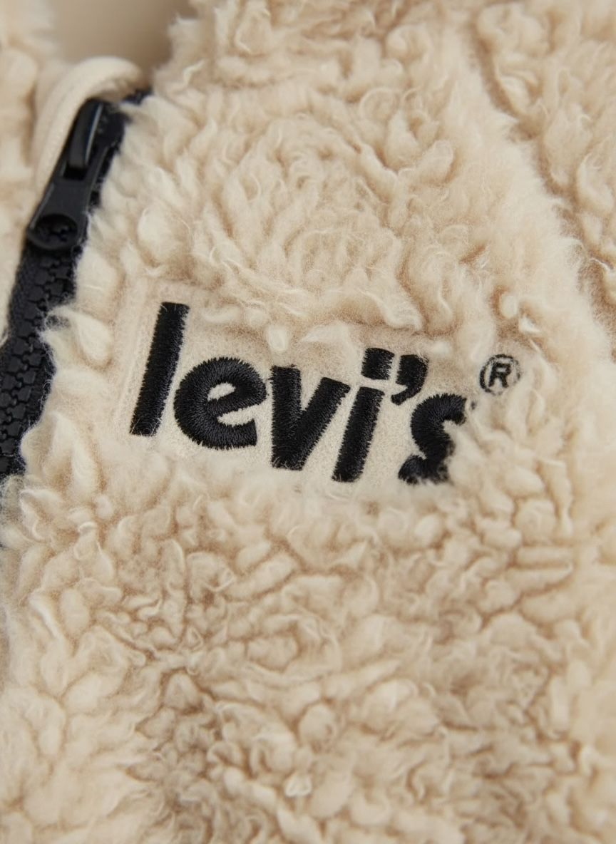 Combinezon plusat Levi’s bej cu detalii bleumarin
