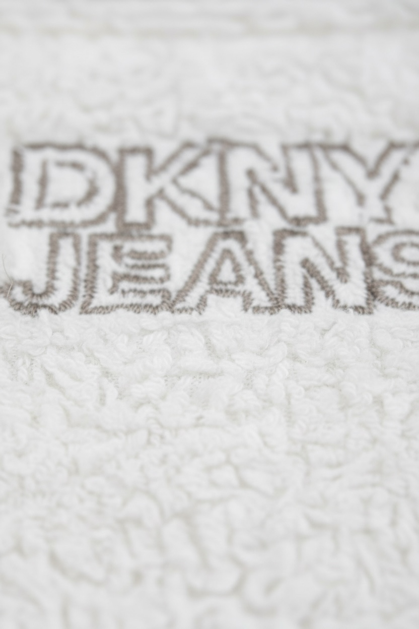 Set bebeluși DKNY, salopetă albă elegantă și body interior