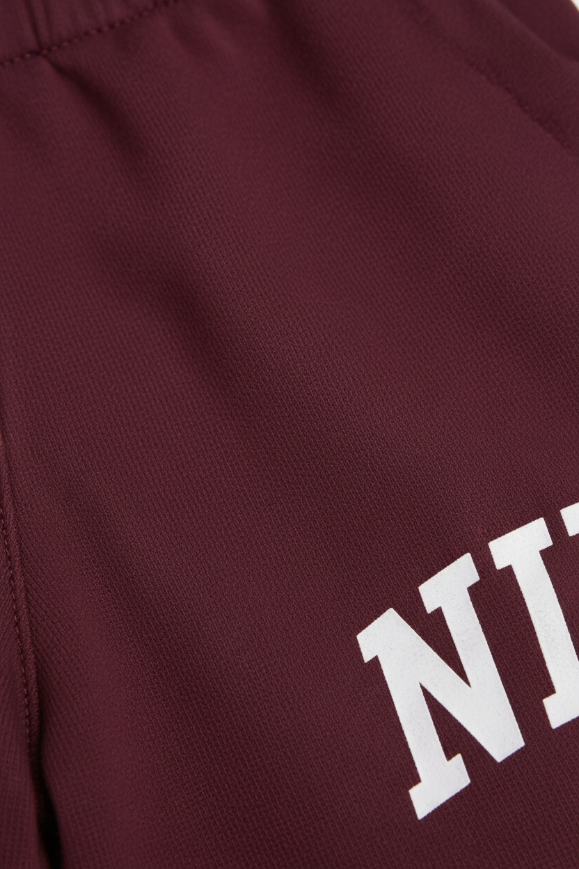 Pantaloni Nike burgundy cu logo lateral